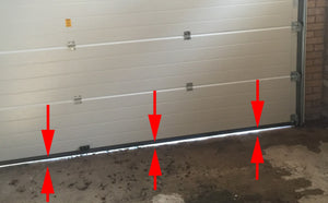  Flèches indiquant l'écart de la porte de garage et comment le mesurer